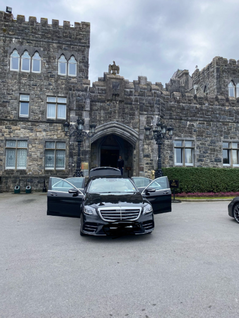 Lir executive chauffeur car waiting outside a castle hotel in Ireland