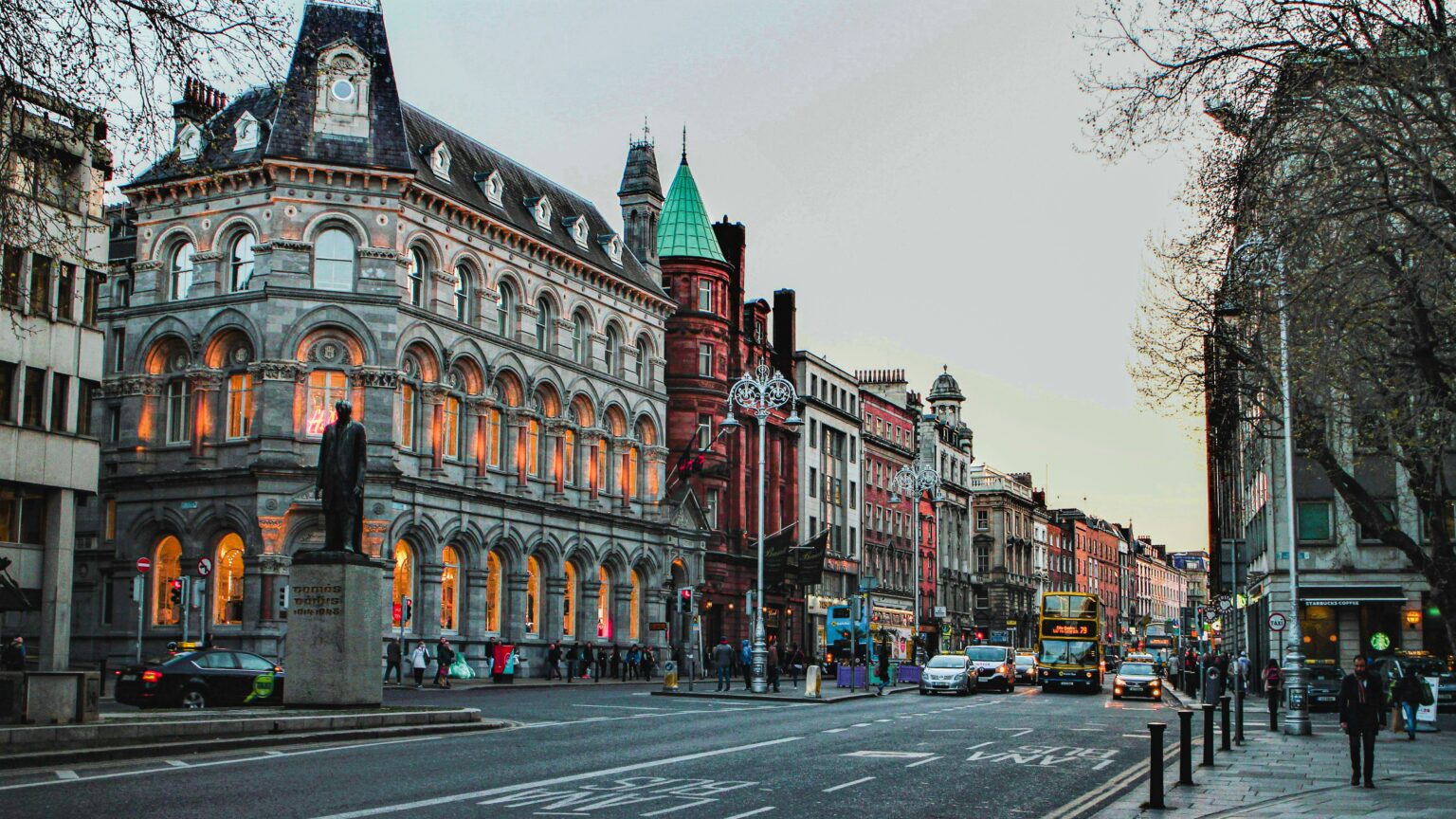 Book a chauffeur in Dublin: evening view of Dame Street and College Green in Dublin city centre