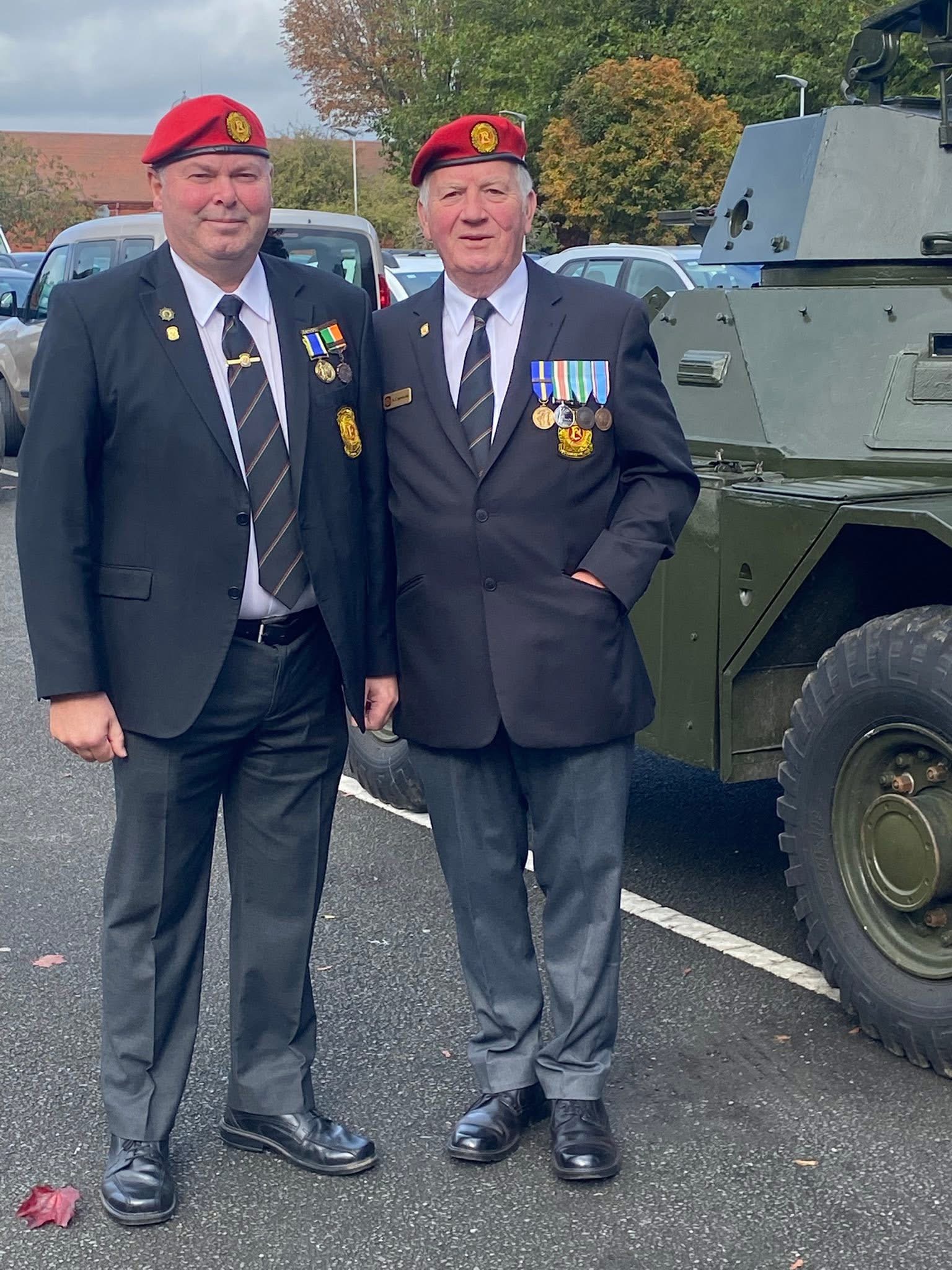 Alan McLoughlin, founder of Lir and former Irish Defence Forces Military Police, in uniform beside an armoured vehicle